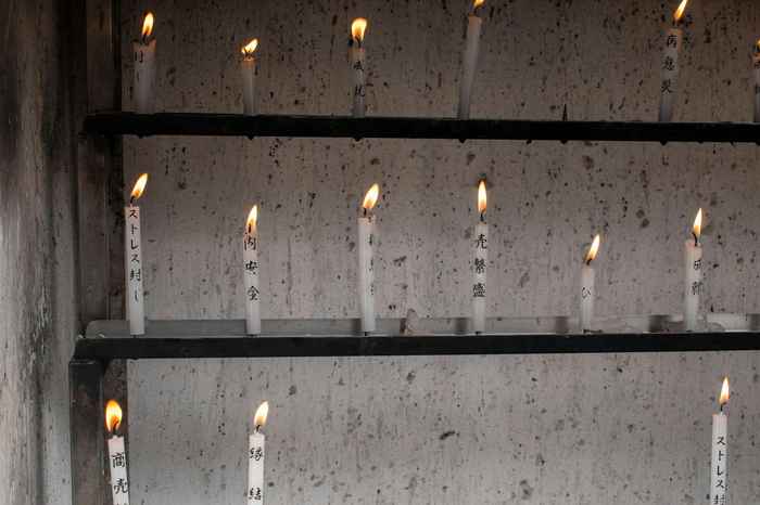 Candle and prayer at a Japanese temple representing Ohenro as a memorial tribute for the deceased