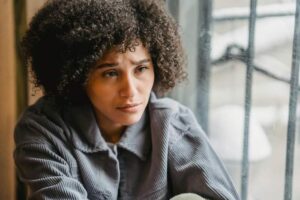 A quiet moment by a window — the helpless feeling of having a hospitalized family member far away