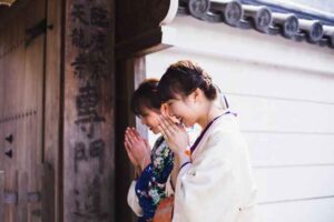 Quiet scene of considering shrine vs temple for healing prayer