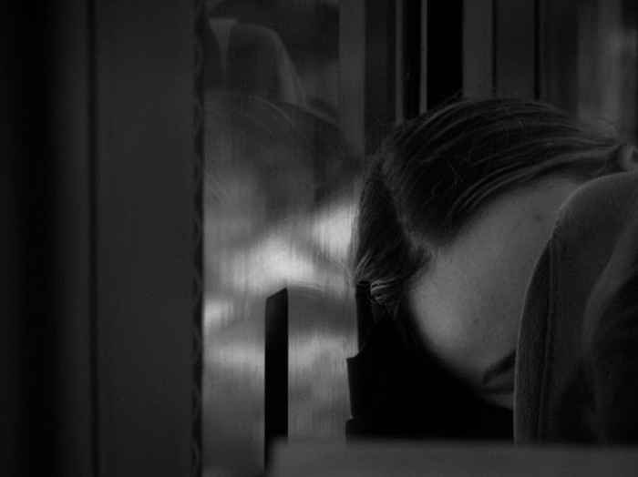 Quiet scene of carrying caregiver fatigue and emotional weight