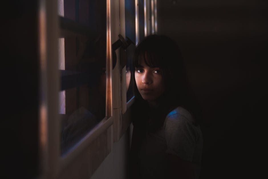 A bereaved family member quietly sitting with the unresolved feelings that often appear after the 49th-day memorial